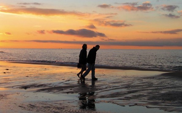 Hotel Neptun - Rostock-Warnemünde - Baltic Sea - Evening walk on the Baltic Sea in Warnemünde Couple on an evening walk at the Baltic Sea in Warnemünde | Hotel Neptun - Rostock-Warnemünde - Baltic Sea