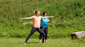 Nationalpark-Hotel-Schliffkopf - Outdoor gymnastics Guest and yoga trainer practice in the garden of the Nationalpark-Hotel Schliffkopf, Baden-Wuerttemberg, Black Forest, Schliffkopf-Baiersbronn
