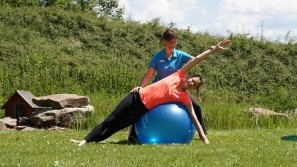 National Park Hotel Schliffkopf - WohlFit Yoga with trainer on a big ball in the garden of the Nationalpark-Hotel Schliffkopf, Baden-Wuerttemberg, Black Forest, Schliffkopf-Baiersbronn