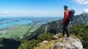 Wellnesshotel Summer - Hiker Hiker looking at the Forggensee at the Wellnesshotel Sommer, Allgäu, Füssen